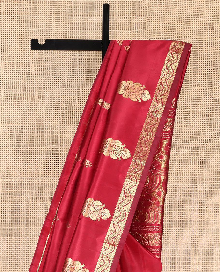 Red Kanchipuram Silk Saree, Beautified with Zari Buttas, Highlighted by Rettai Pettu Traditional Zari Motifs Woven Border, Pallu Features Floral Designs, and Comes Without a Blouse