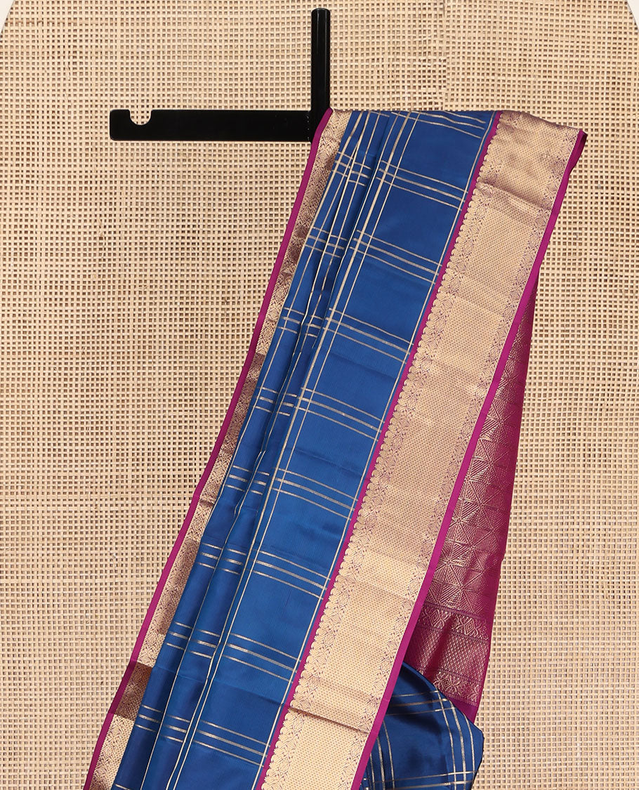 Blue Kanchipuram Silk Saree, Ornamented with Zari Checked Design on Its Body, Complemented by a Contrast Border of Manga, Rekku, Cross Kamalam, and Mayil Kann Designs, Grand Jaal Pallu, and Paired with a Contrast Blouse
