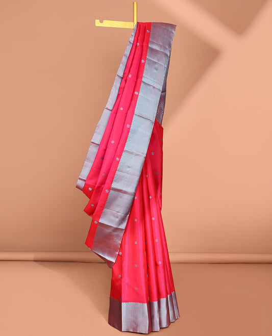 Pink buttas kancheepuram silk saree with contrast border of thilakam mokku, paun, kuyil kann design & zari design pallu