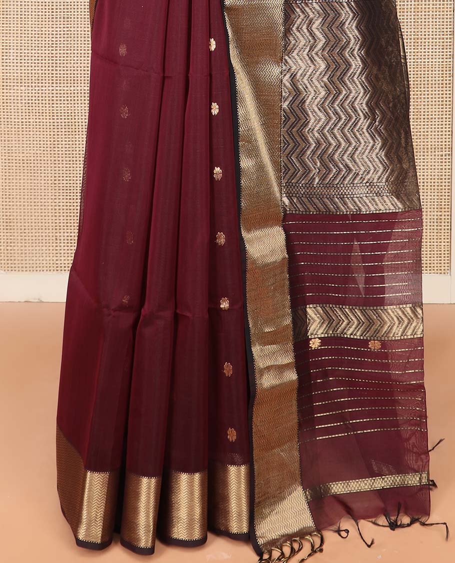Maroon Maheshwari Cotton Saree Beautified with Floral Buttas, Highlighted with a Chevron Striped Zari Border, Pallu Steeped with Zari Stripes and Chevron Stripes, and Paired with a Matching Blouse