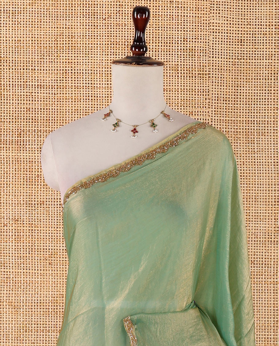Pista green fendy chiffon saree with hand work border & self pallu along with hand work blouse