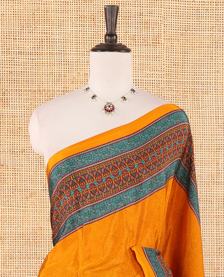 Mustard negative-style sparsely printed crepe silk saree, contrast printed border, printed pallu & printed blouse