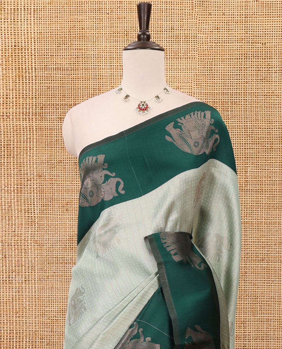 Pista green zari checked & elephant motifs woven kanchi silk saree, contrast korvai-style border of elephant motifs, intricate pallu & plain blouse