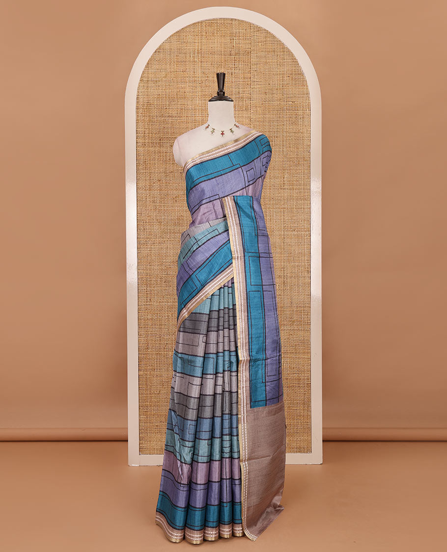 Blue abstract geometric printed semi-tussar saree, contrast thread triangle motifs border, striped pallu & contrast striped blouse