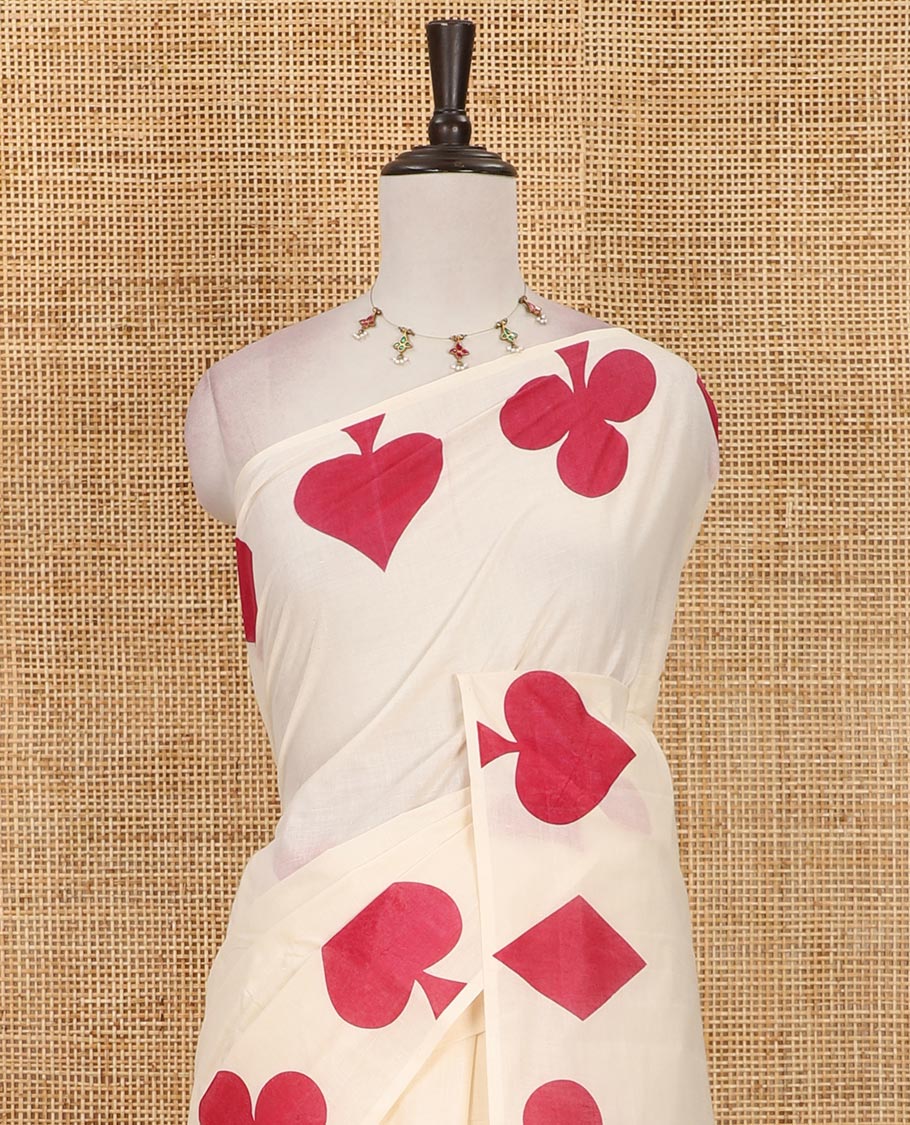 Cream-maroon plain Kerala cotton saree, contrast color cards-theme printed border of Diamonds, Clubs, and Spades, leheriya-striped pallu, and plain blouse