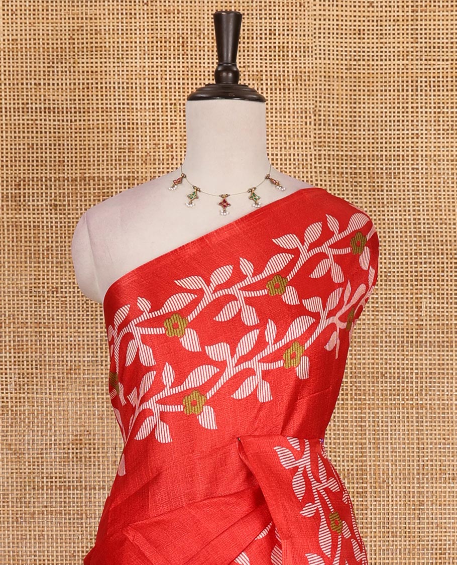Red plain khadi cotton saree, floral creeper printed border, and pallu with small buttas printed blouse
