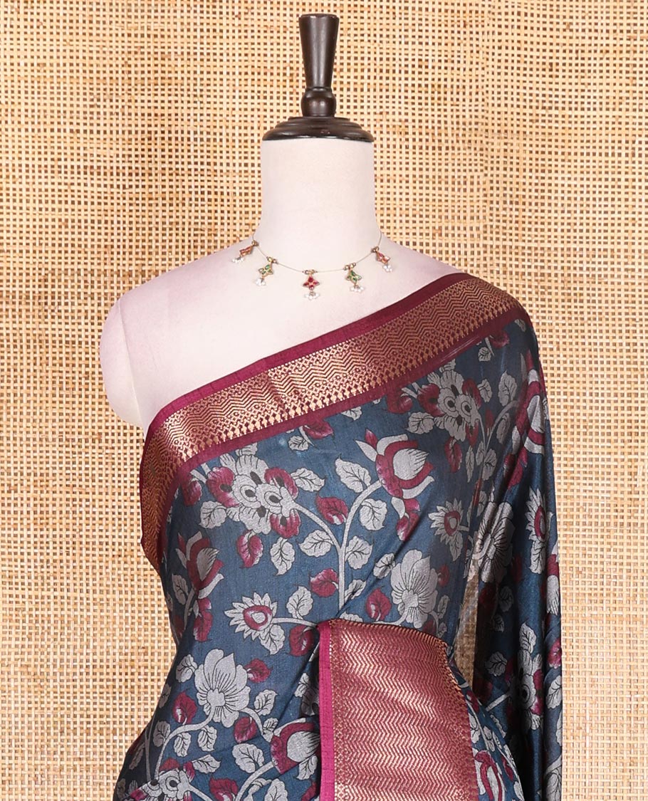 Navy blue kalamkari floral vine and peacock printed dola silk saree, contrast traditional zari border, peacock printed pallu, and floral vine print blouse