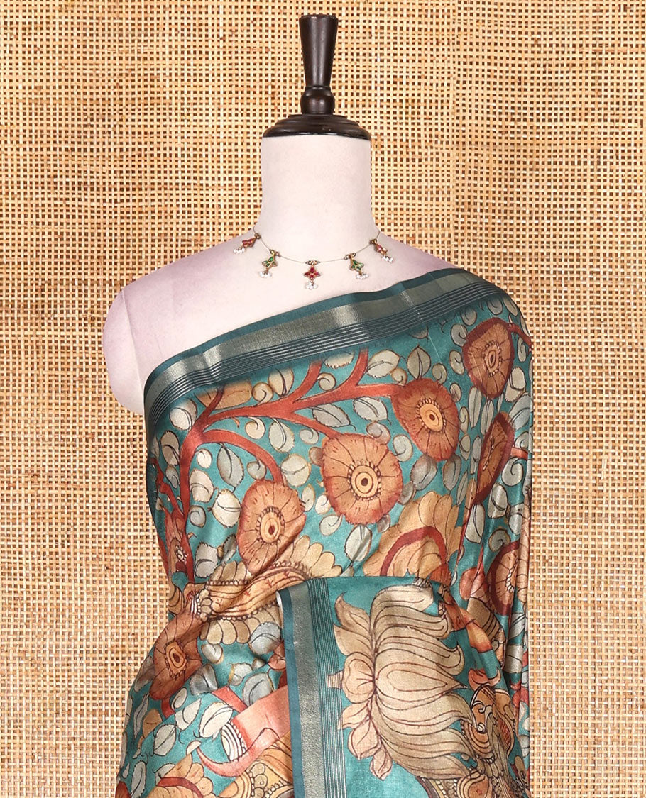Rama green kalamkari elephant, peacock, and floral printed semi-tussar saree, zari piping border, kalamkari motifs printed pallu, and contrast printed blouse