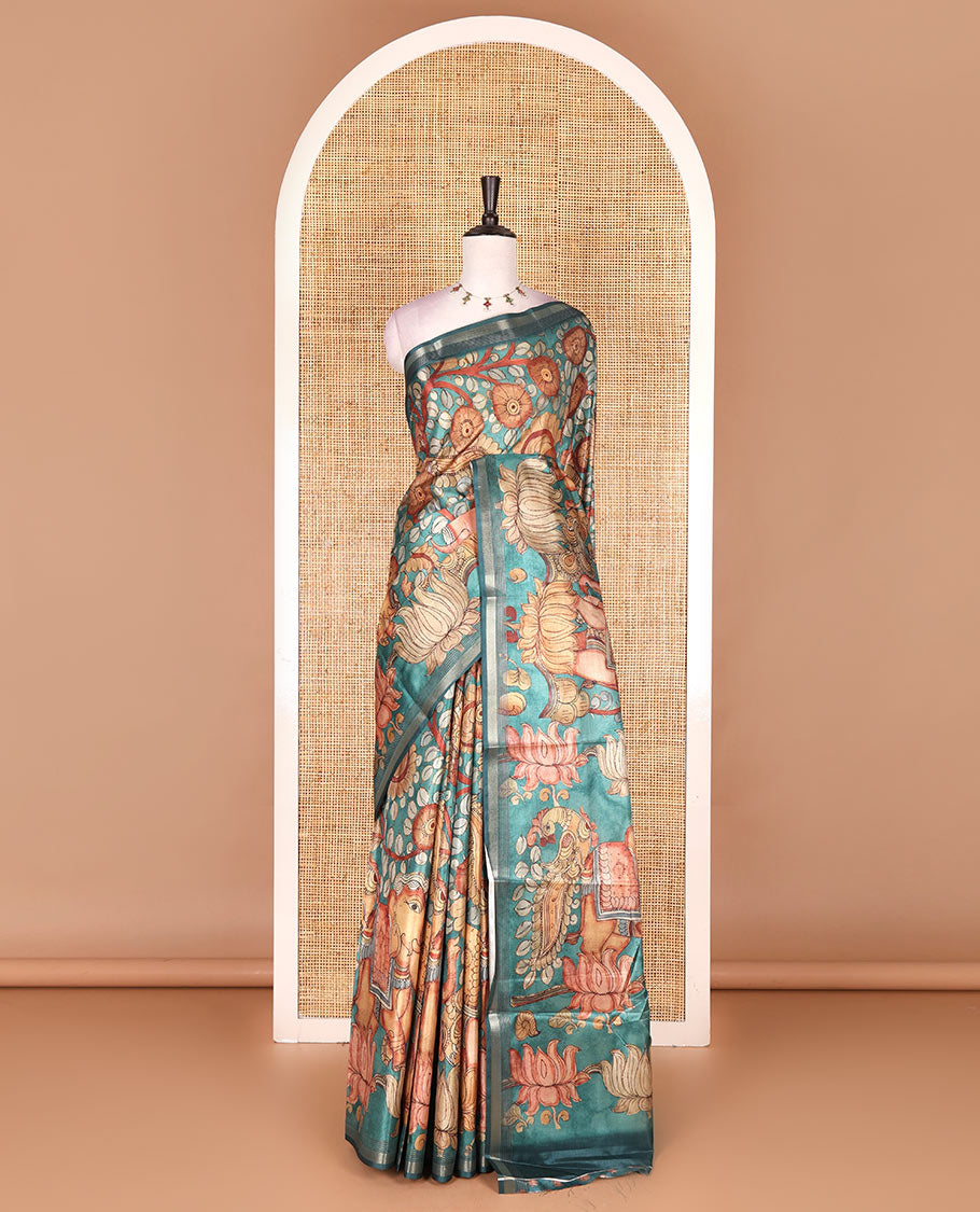 Rama green kalamkari elephant, peacock, and floral printed semi-tussar saree, zari piping border, kalamkari motifs printed pallu, and contrast printed blouse