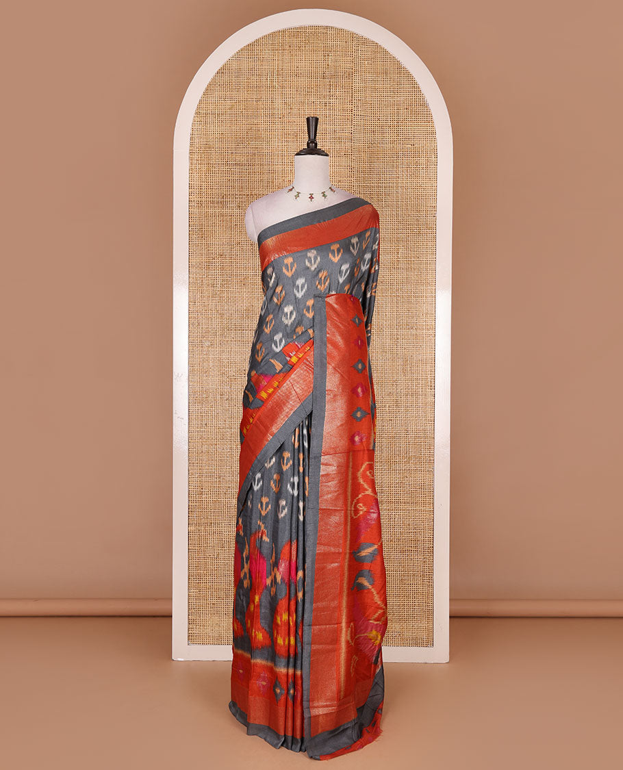 Grey pochampally style floral, and peacock printed dola silk saree, zari border, pallu of ikkat designs, and contrast ikkat motifs blouse