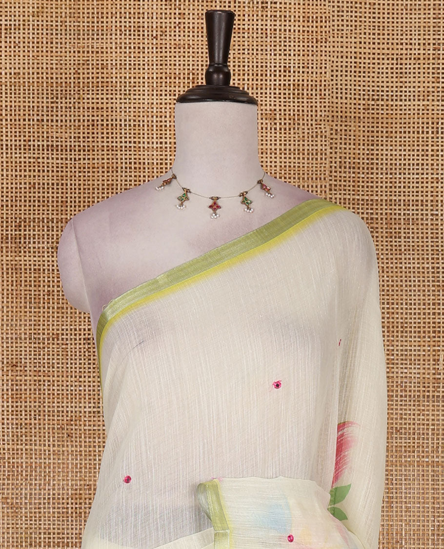 Light green colorful floral vine printed with mirror embroidered linen saree, contrast zari piping border, and contrast printed blouse