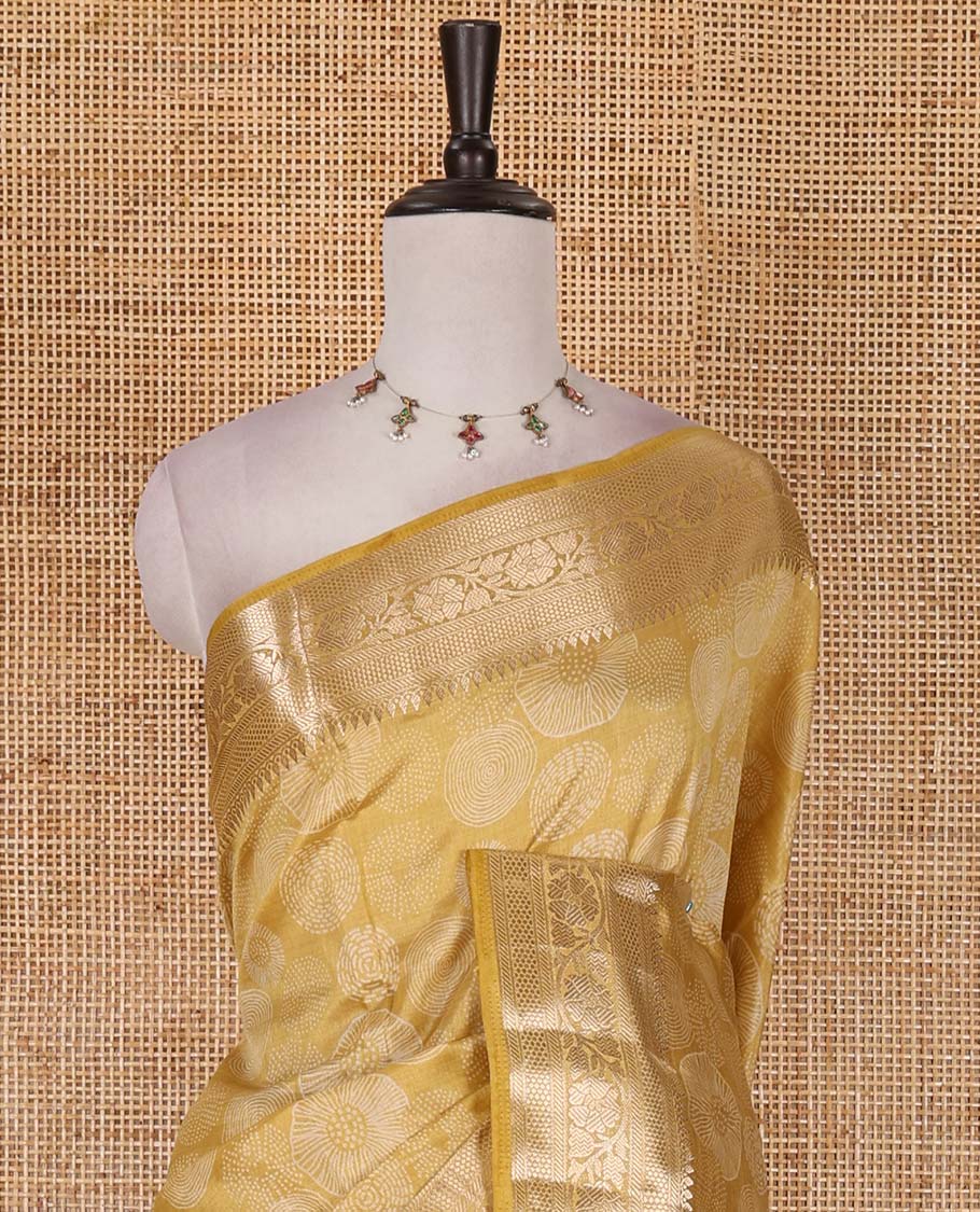 Gold uniquely printed semi-tussar saree, traditional zari border, zari striped pallu, and a matching blouse