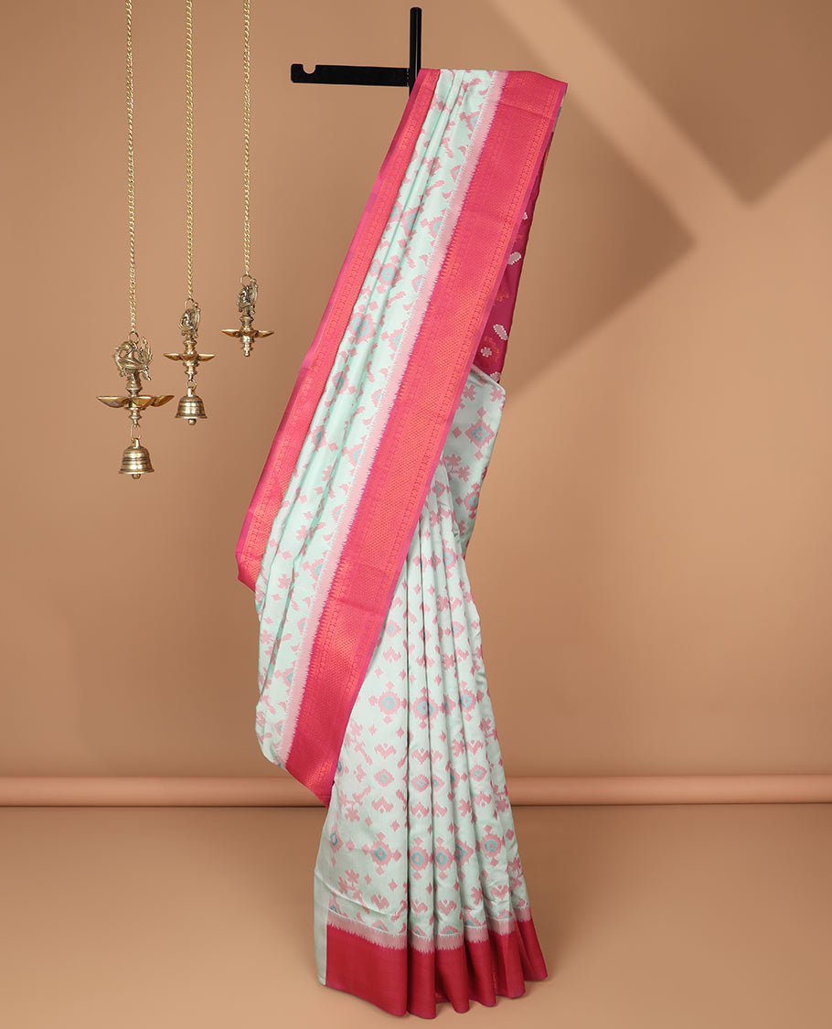 Mint green ikkat design mulberry silk saree with contrast border & ikkat pallu along with self embosed butta blouse