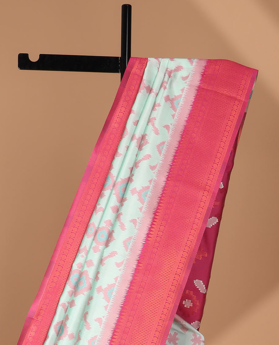 Mint green ikkat design mulberry silk saree with contrast border & ikkat pallu along with self embosed butta blouse