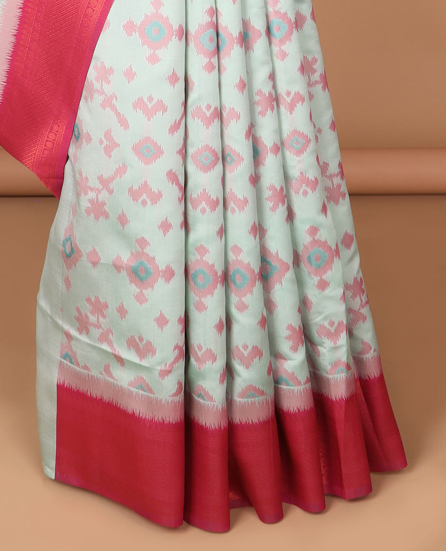 Mint green ikkat design mulberry silk saree with contrast border & ikkat pallu along with self embosed butta blouse