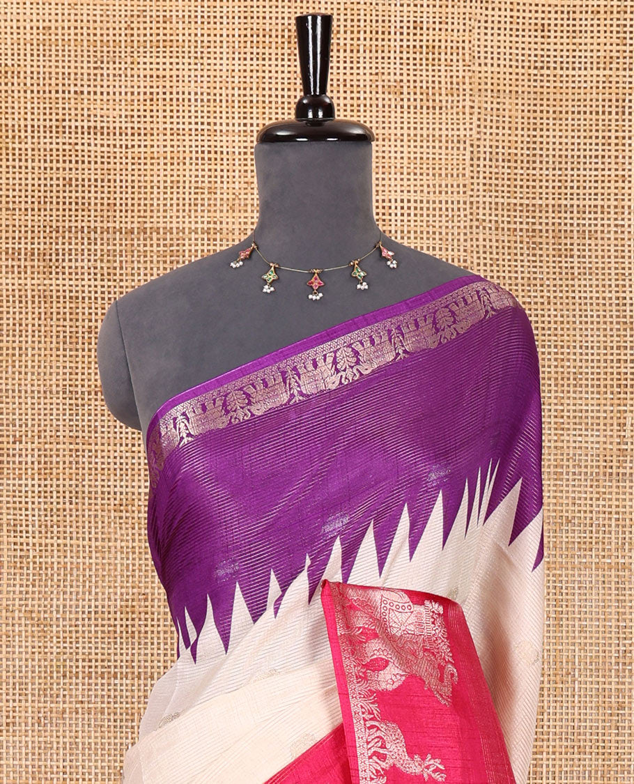 Half-white zari stripes and buttas dola silk saree, contrast pink-purple Ganga-Jamuna temple elephant motifs border, paisleys printed pallu, and contrast elephant buttas blouse