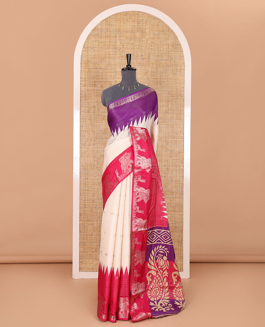 Half-white zari stripes and buttas dola silk saree, contrast pink-purple Ganga-Jamuna temple elephant motifs border, paisleys printed pallu, and contrast elephant buttas blouse