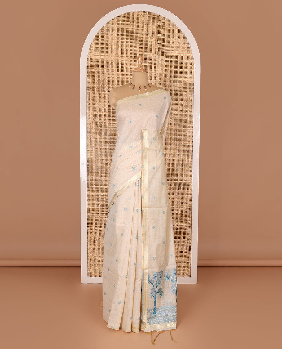 Cream resham thread and zari buttas Munga cotton saree, traditional gold zari border, tree motifs blue thread work pallu, and matching buttas blouse