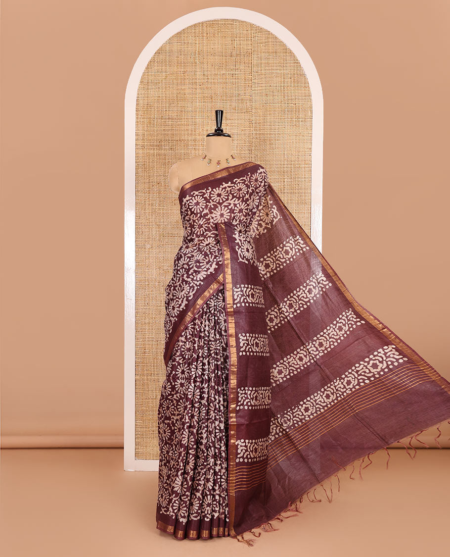Wine floral design batik-printed Bhagalpur cotton saree, zari piping border, batik-printed pallu, and a plain blouse