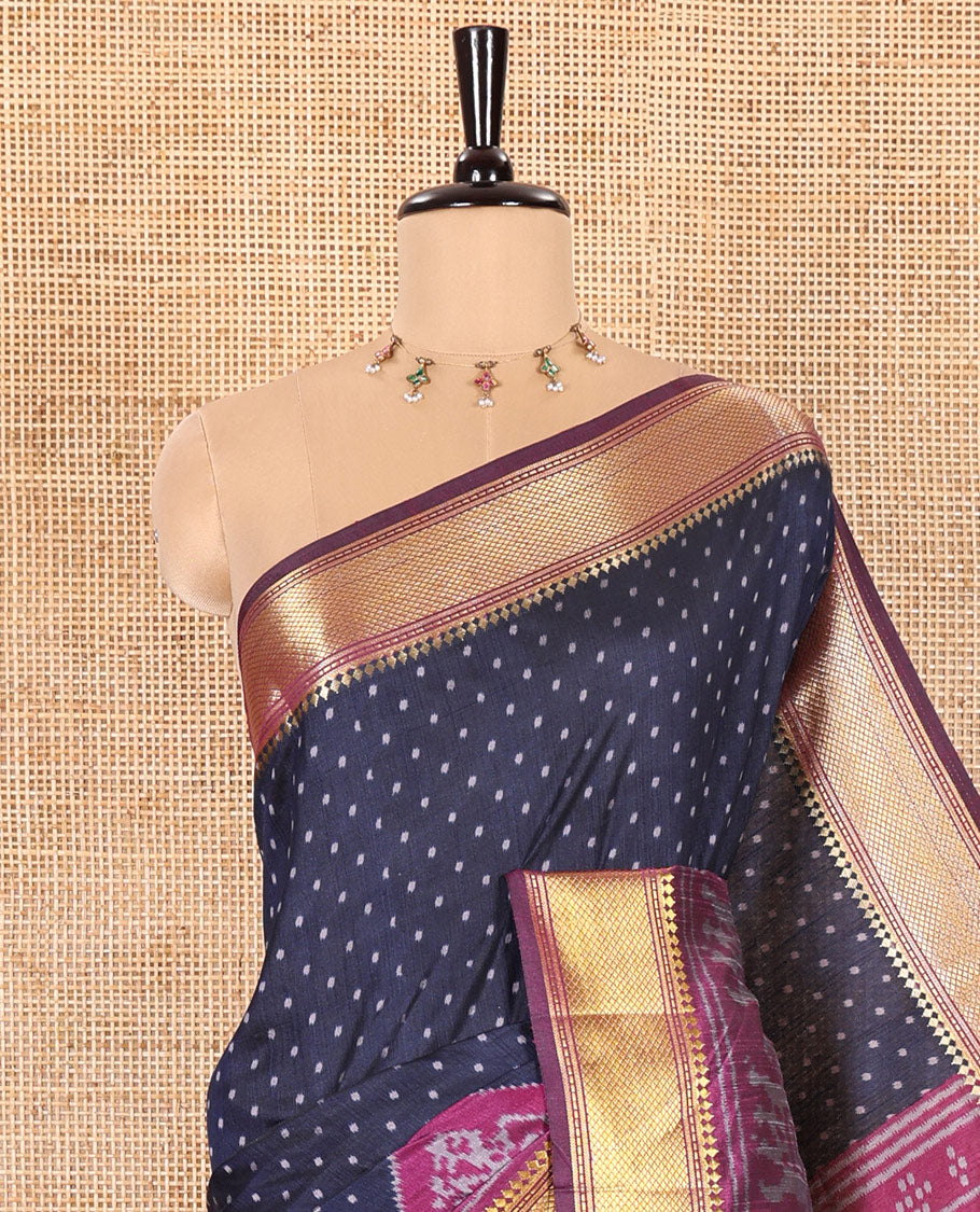 Navy Blue Patola Saree Subtly Sparked with Ikkat Style Polka Dots and Elephant Buttas, Complemented by a Contrast Traditional Zari Design Border, Featuring Pallu Steeped with Elephant Motifs, and Paired with a Contrast Blouse