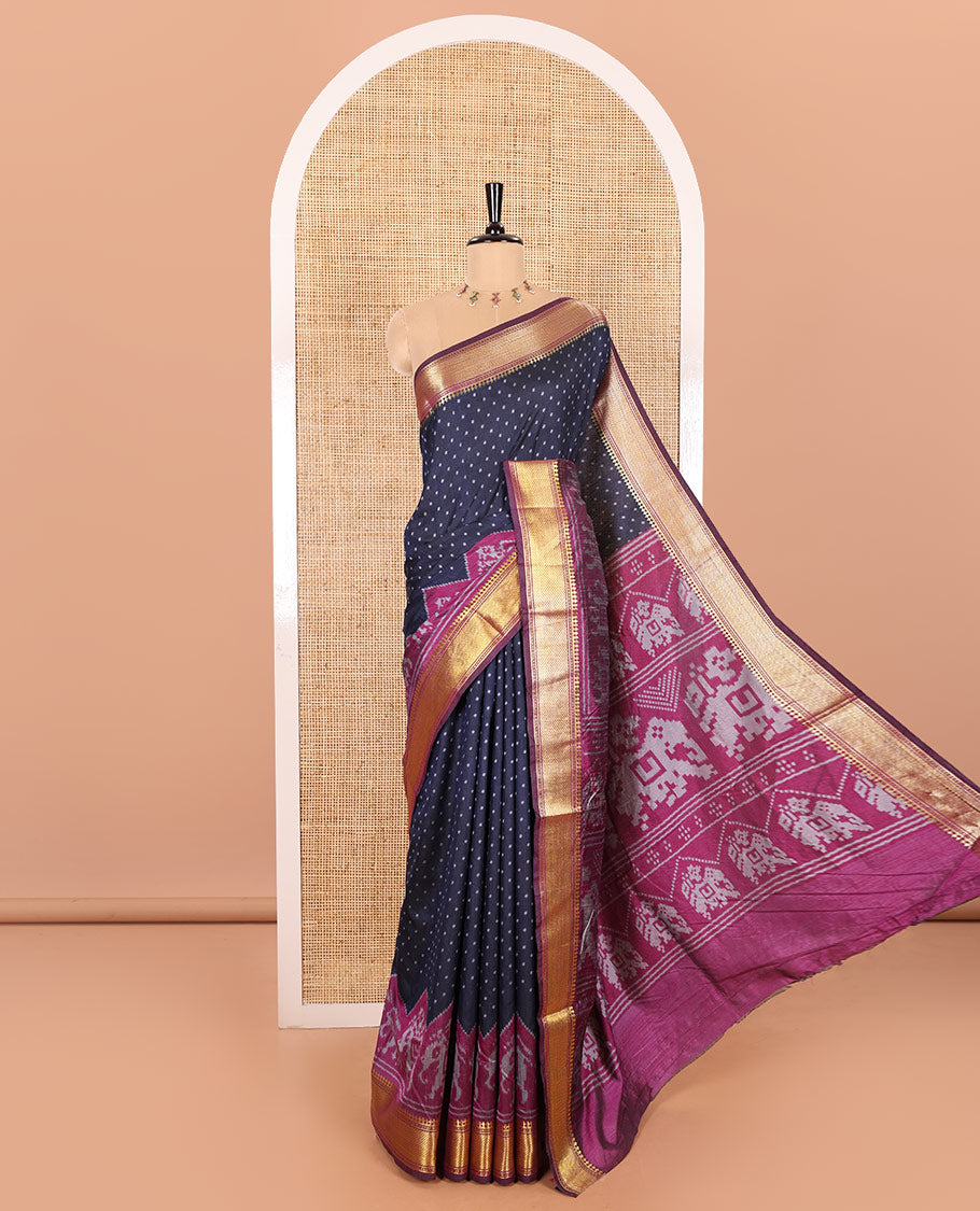 Navy Blue Patola Saree Subtly Sparked with Ikkat Style Polka Dots and Elephant Buttas, Complemented by a Contrast Traditional Zari Design Border, Featuring Pallu Steeped with Elephant Motifs, and Paired with a Contrast Blouse