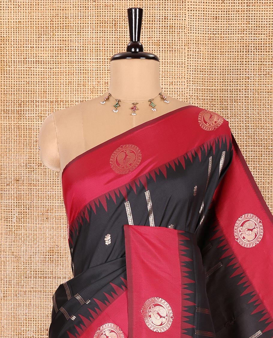 Black Elite Soft Silk Saree, Mesmerized with Zari Buttas and Zari Stripes All Over Its Body, Complemented by a Contrast Temple Border of Round Peacock Designs, Rich Pallu of Peacock Chakram Butta Enclosed Checks, and Paired with a Contrast Blouse