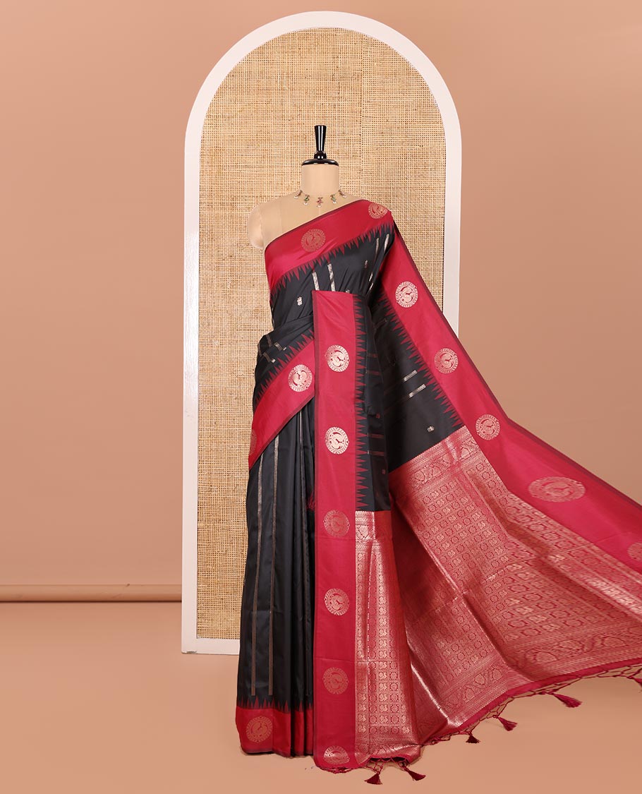 Black Elite Soft Silk Saree, Mesmerized with Zari Buttas and Zari Stripes All Over Its Body, Complemented by a Contrast Temple Border of Round Peacock Designs, Rich Pallu of Peacock Chakram Butta Enclosed Checks, and Paired with a Contrast Blouse