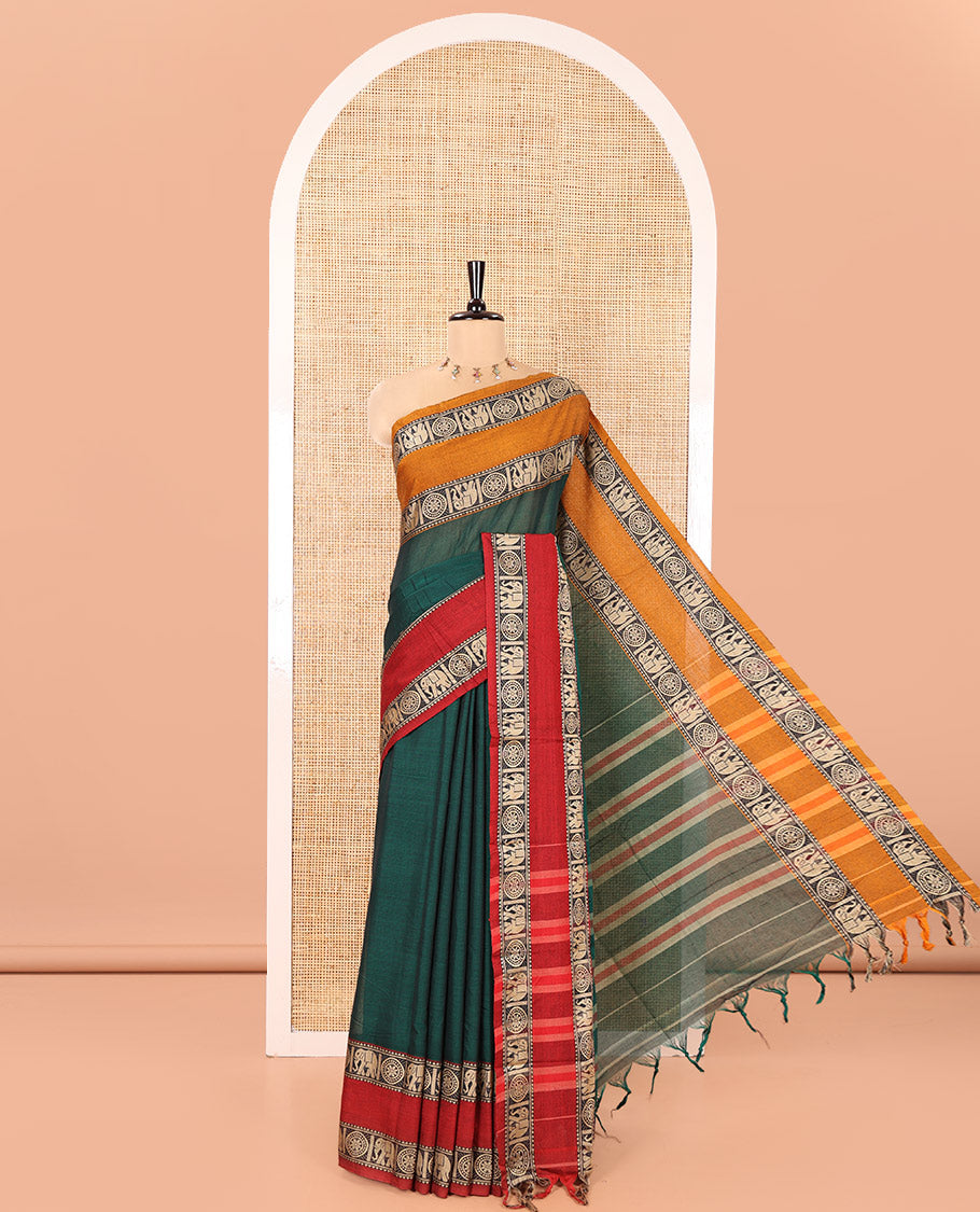 Green Plain Mercerised Cotton Saree, Complemented by a Contrast Ganga-Jamuna Rettai Pettu Thread Border of Temple, Elephant, and Chakram Designs, Subtly Striped Pallu, and Paired with a Matching Blouse