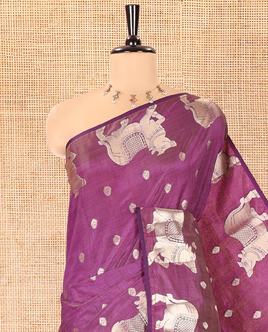 Violet Art Tussar Saree, Delicately Woven with Gold Zari Buttas All Over Its Body, Highlighted by a Zari Border of Pichwai Cow Motifs, Grandly Woven Pallu, and Paired with a Matching Blouse