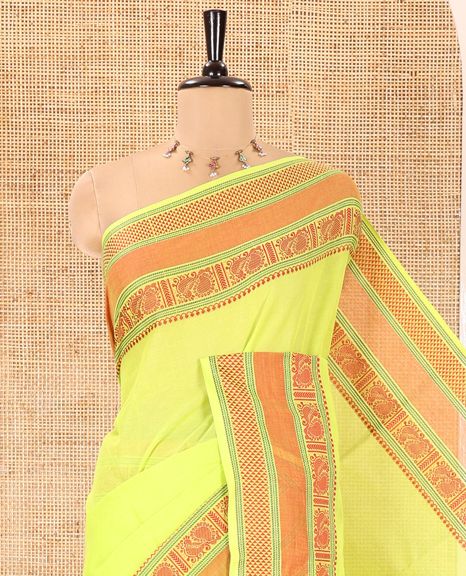 Leaf Green Plain Chettinad Cotton Saree, Delicately Decked Up with Traditional Thread Border Featuring Peacock and Ara Maadam Designs, Subtly Striped Pallu, and Paired with a Matching Blouse