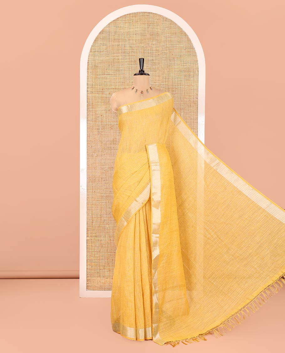 Yellow Linen Zari Cotton Saree, Gleamed Up with Zari Stripes All Over Its Body, a Subtle Zari Border, a Self-Pallu, and Comes Without a Blouse