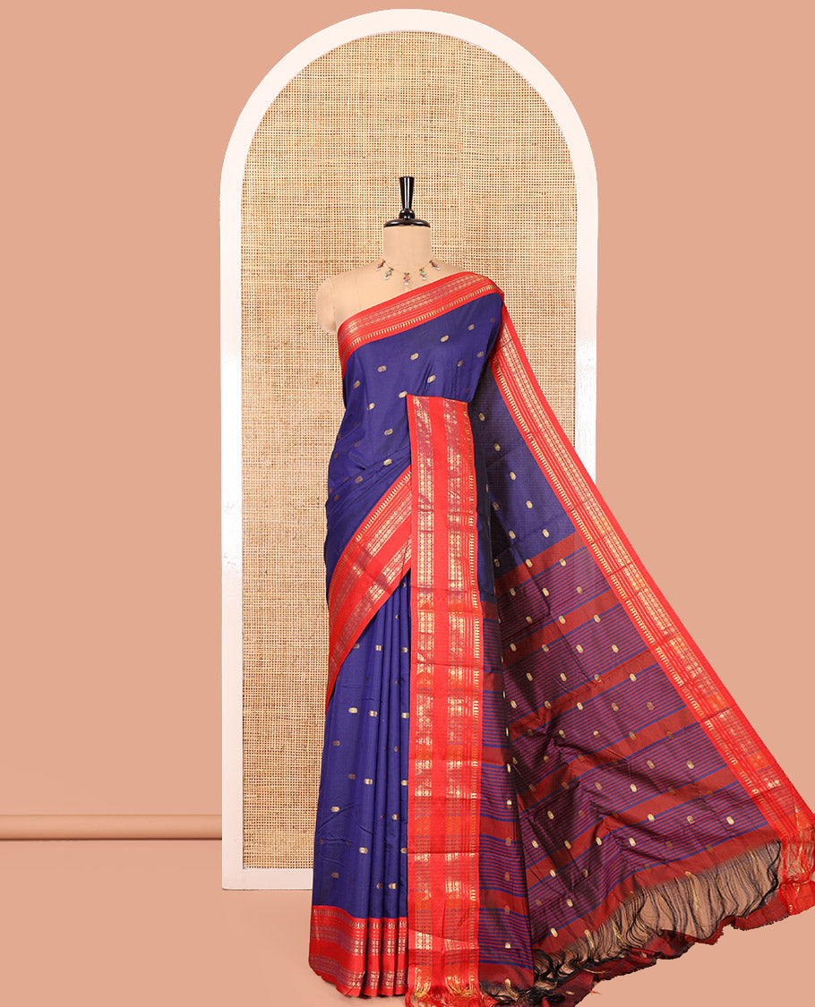 Dark Blue Softy Silk Saree, Delicately Woven With Zari Buttas All Over Its Body, Complemented by Contrast Traditional Zari Varisai Pettu Border, Grand Pallu, and Paired with a Contrast Blouse