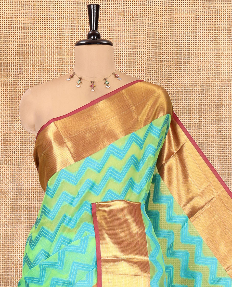 Parrot Green Semi-Organza Saree Features Pochampally Ikat Chevron Stripes, a Contrast Border, Paisley Pallu, and Contrast Blouse