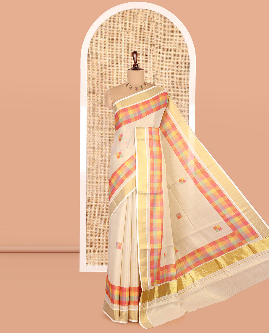 Gold-Pink Kerala Tissue Cotton Saree Features Madras Checked Buttas, a Zari Checked Border, and a Contrast Blouse