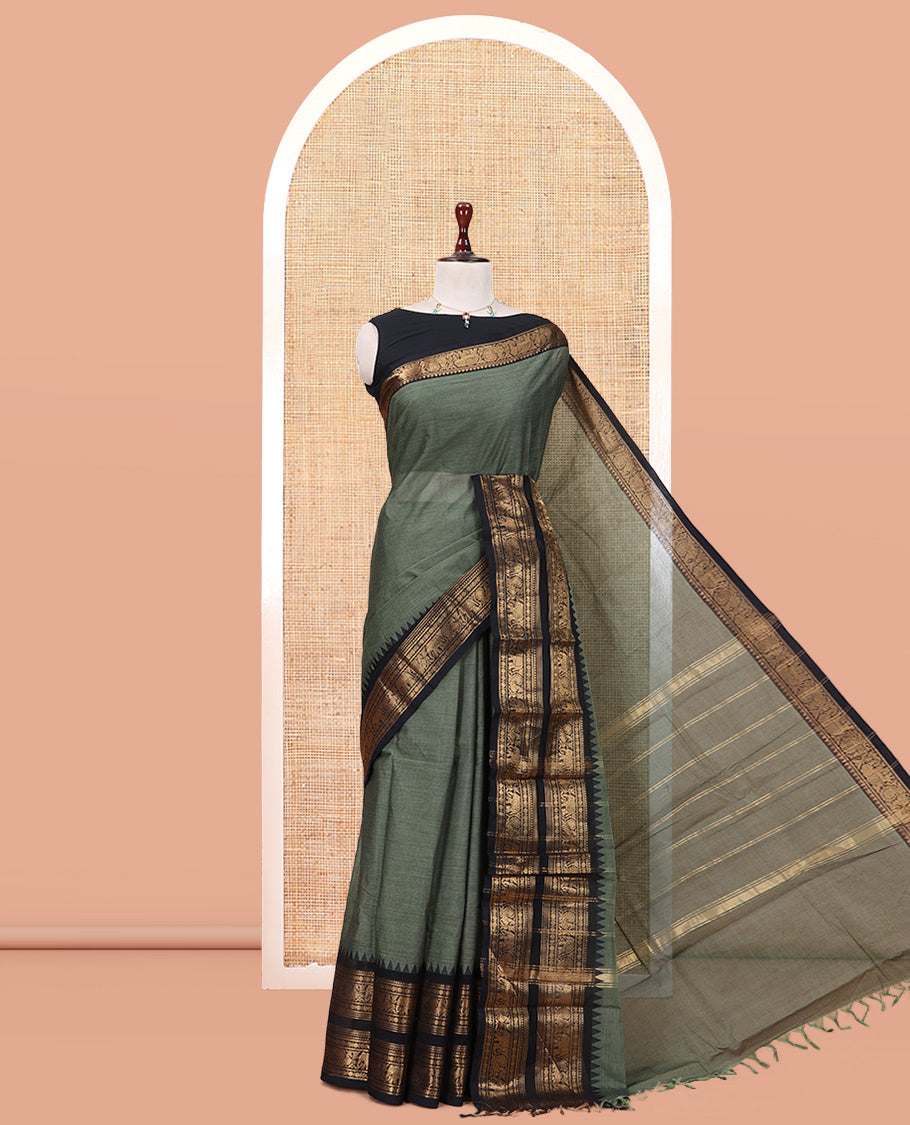 Green Plain Chettinad Cotton Saree, Complemented by a Contrast Rettai Pettu Elephant-Peacock Temple Border, a Matching Blouse