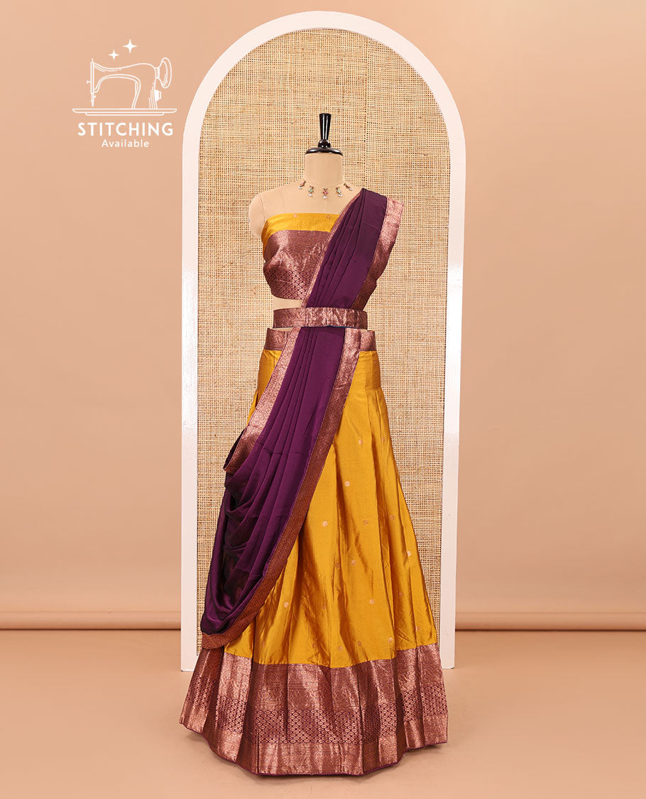 Mustard-wine taffeta half-saree, zari buttas with contrast traditional zari bordered skirt, a matching blouse, and contrast zari border dhavani with belt
