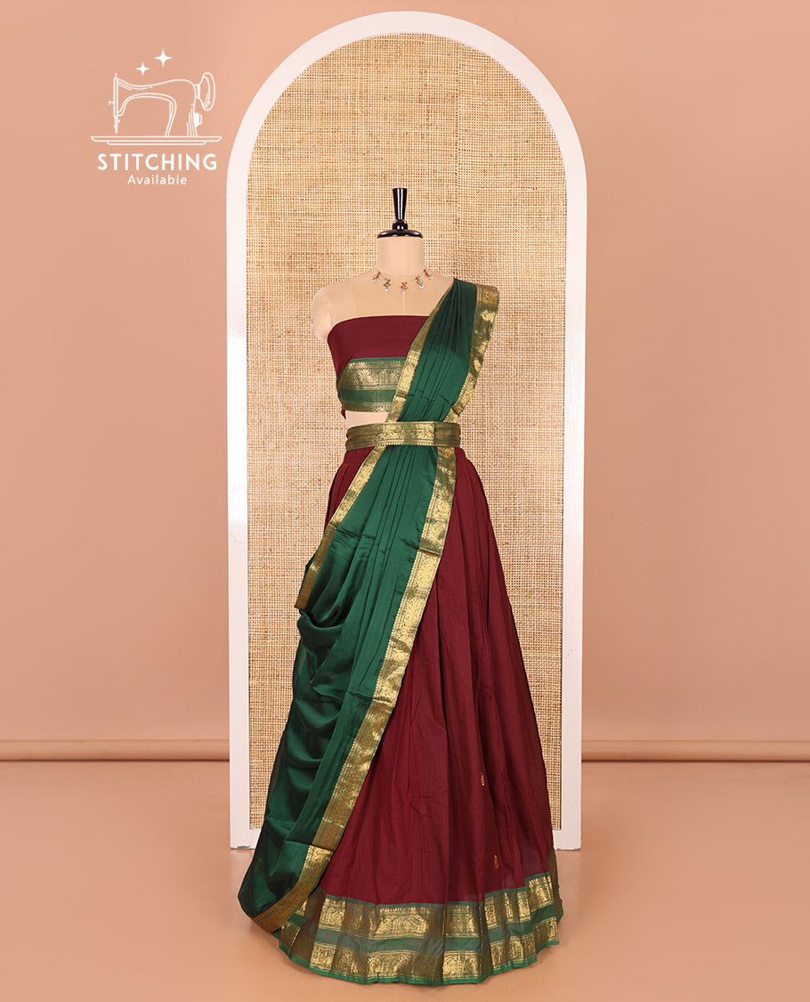 Maroon and Green Chettinad Cotton Half-Saree Featuring Buttas Woven Skirt, Highlighted with a Contrast Rettai Pettu Peacock Motifs Woven Zari Border, a Subtly Woven Matching Blouse, and a Vichitra Silk Contrast Traditional Zari-Bordered Dhavani
