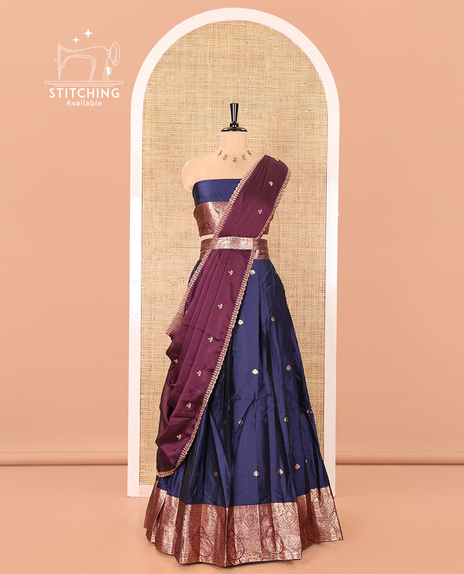 Blue and Purple Semi-Banarasi Half-Saree, Elevated with Zari Buttas on Its Skirt, Complemented by a Contrast Intricately Zari-Designed Border, Paired with a Matching Blouse, and a Contrast Satin Georgette Embroidered Scallop Dhavani
