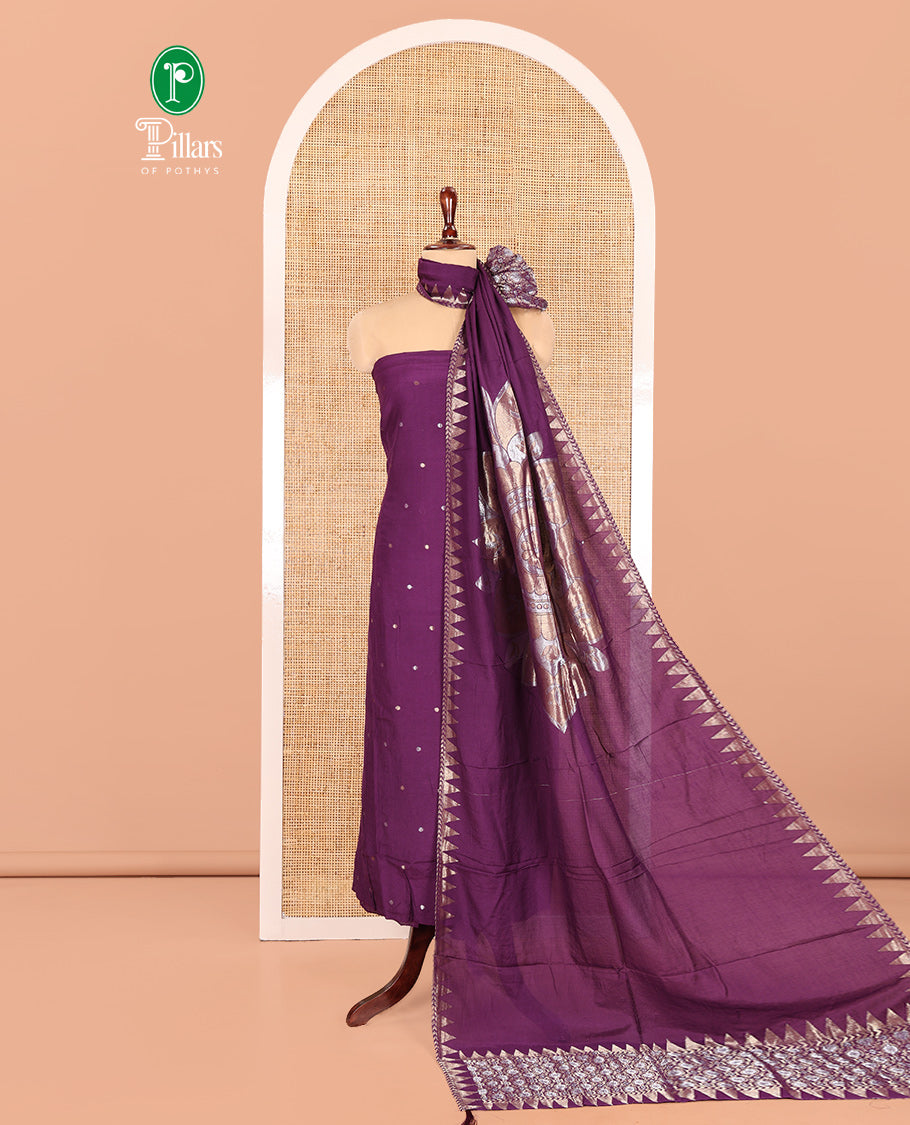 Dark Purple Semi-Silk Material Churidar Features Zari Buttas Skirt, a Plain Bottom, and a Floral Motif Zari Woven Dupatta
