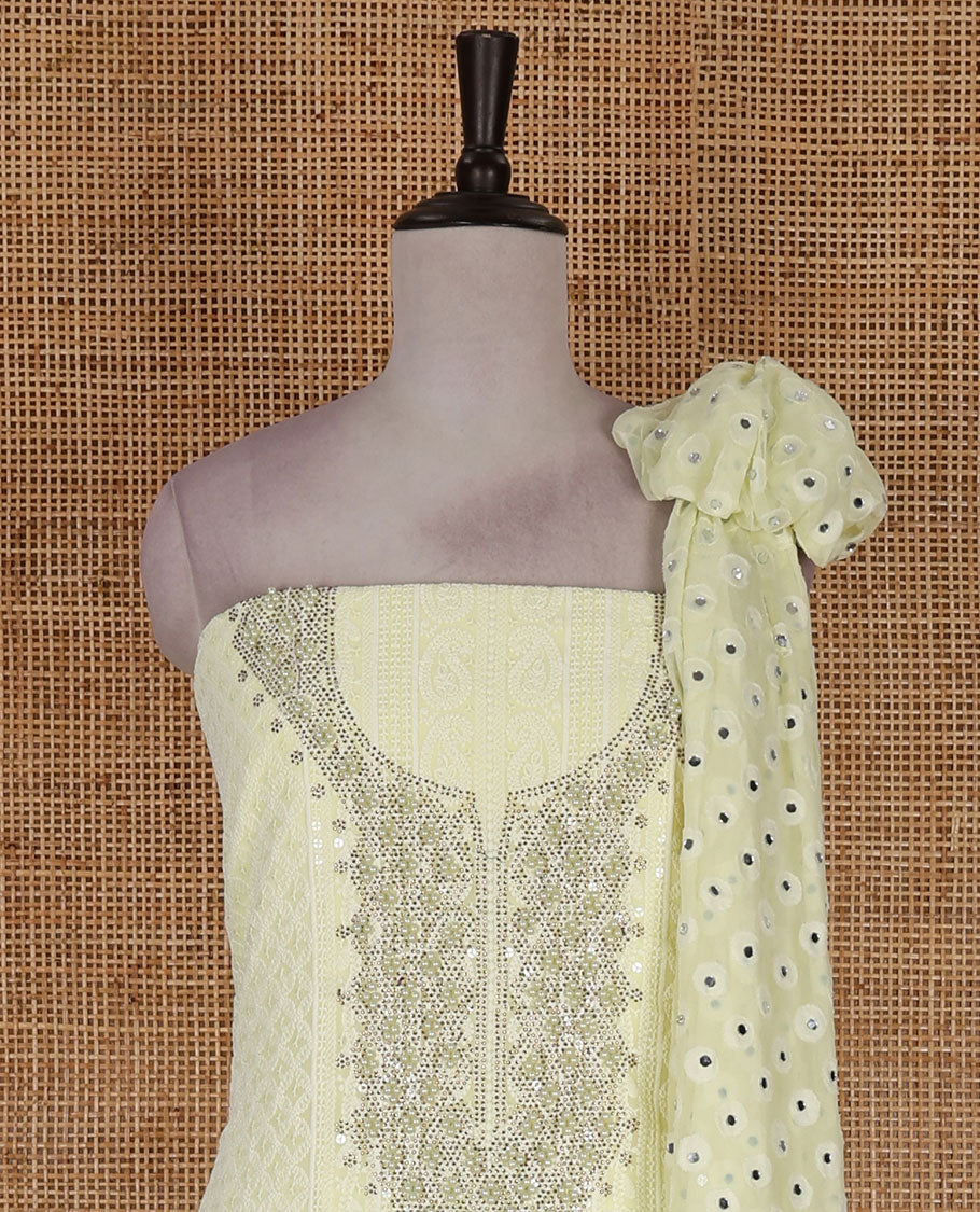 Lime yellow material churidar set, stone work with Schiffli style embroidered georgette top, American Crape bottom, and polka dotted printed mirror work dupatta