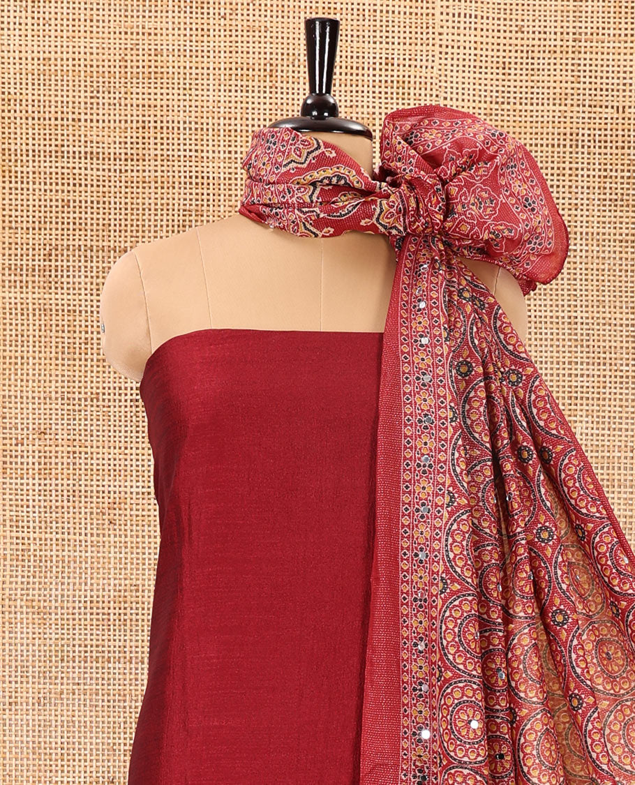 Maroon material chudidar set, plain Vichitra silk top, santoon bottom, and dupatta of Ajrakh print and mirror work