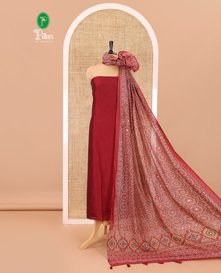 Maroon material chudidar set, plain Vichitra silk top, santoon bottom, and dupatta of Ajrakh print and mirror work