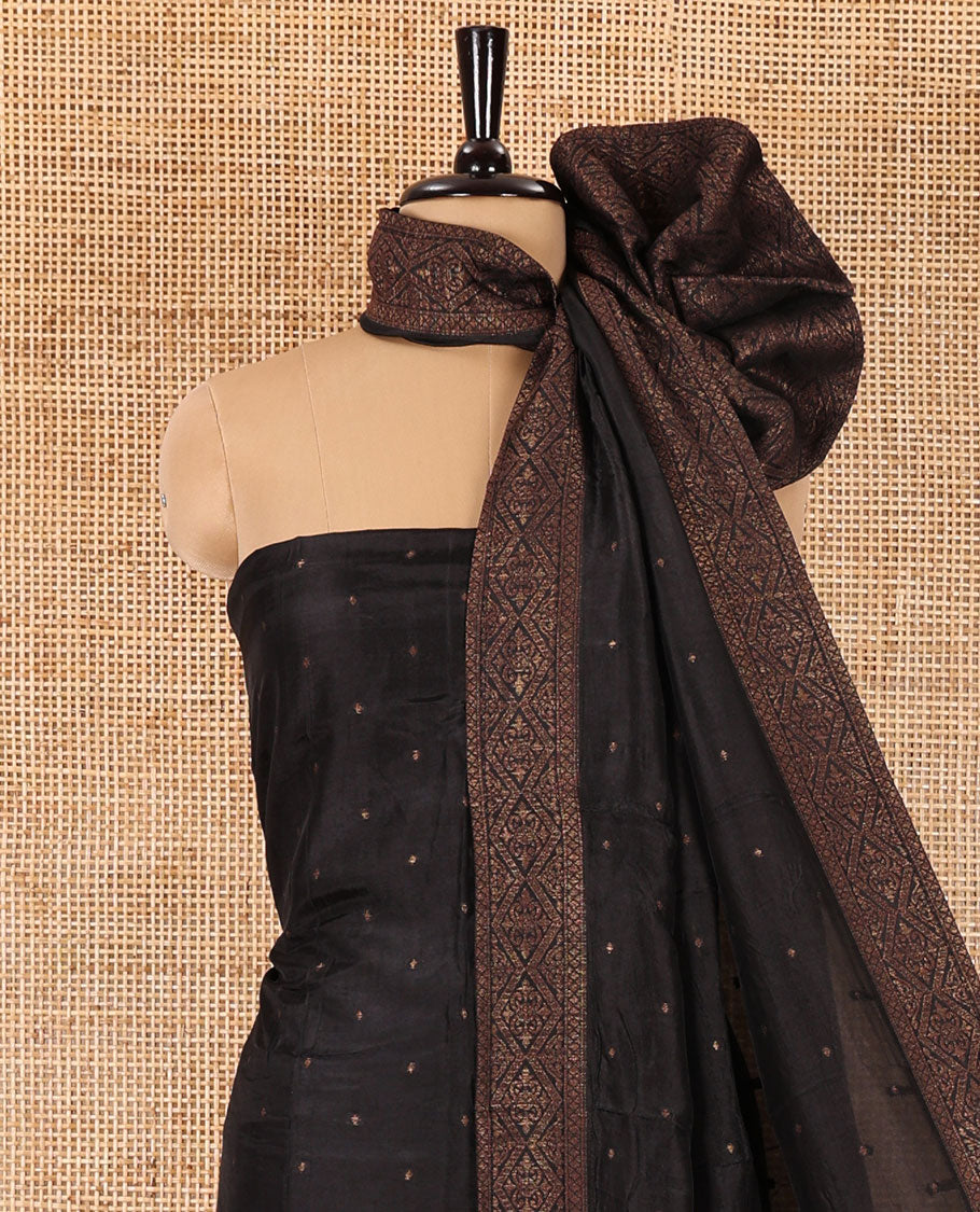 Black material chudidar set, copper zari buttas and jaal design semi-modal silk top, plain santoon bottom, and zari design woven semi-modal silk dupatta