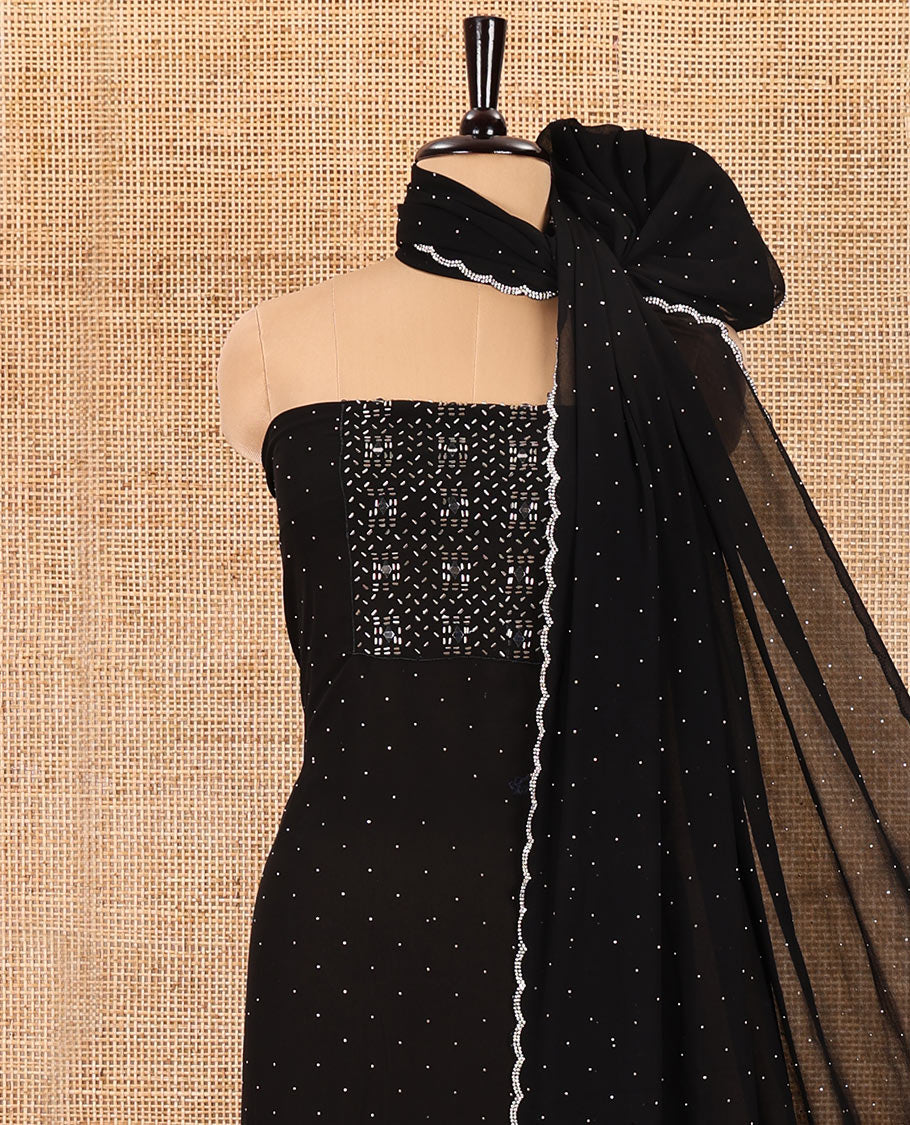 Black material chudidar set, silver stone embroidered with neck bead work georgette top, santoon plain botom, and scallop swarovski stone work dupatta
