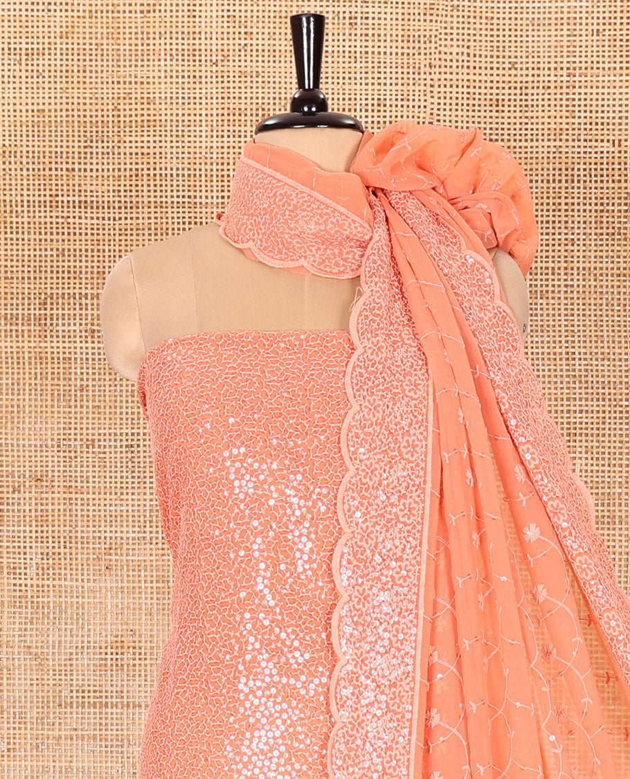 Peach Material Chudidar Set Features Sequin Embroidered Georgette Top, a Plain American Crepe Bottom, and a Scallop Dupatta Embellished with Floral Vine Embroidery