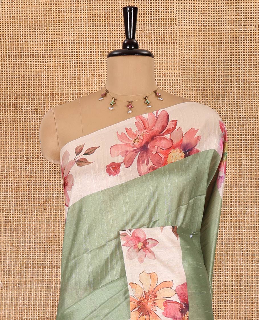Elaichi green plain fancy tussar digital printed saree, contrast floral digital printed border, floral printed pallu, and a floral printed blouse