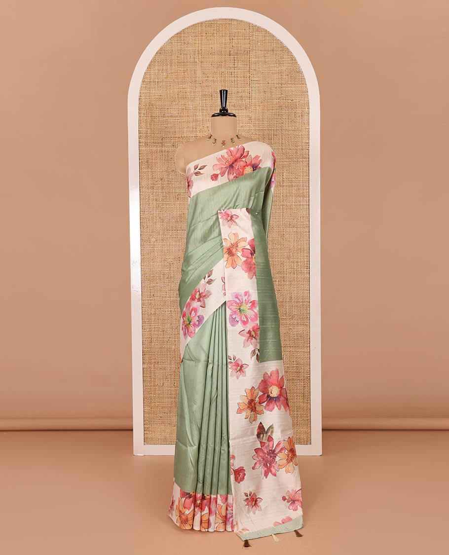 Elaichi green plain fancy tussar digital printed saree, contrast floral digital printed border, floral printed pallu, and a floral printed blouse