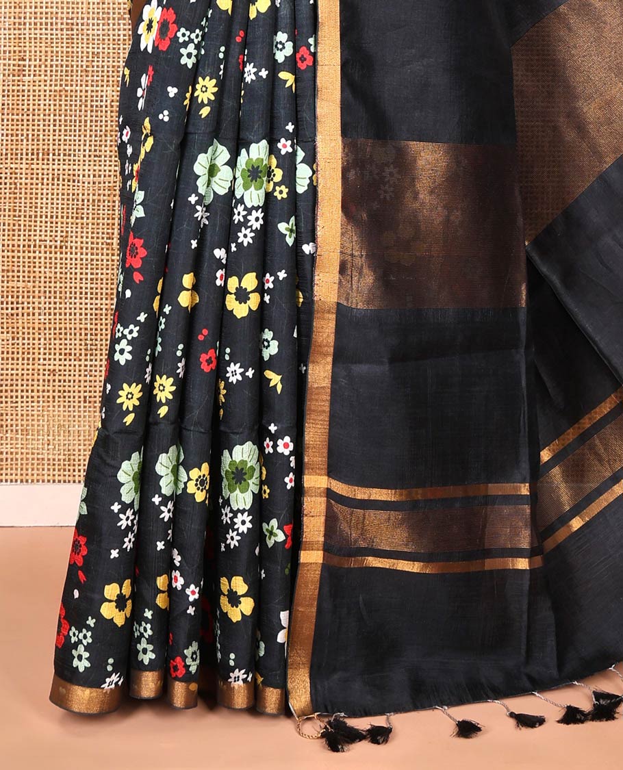 Black colorful floral printed banana pith saree, piping zari border, zari decked pallu, and a contrast floral printed blouse