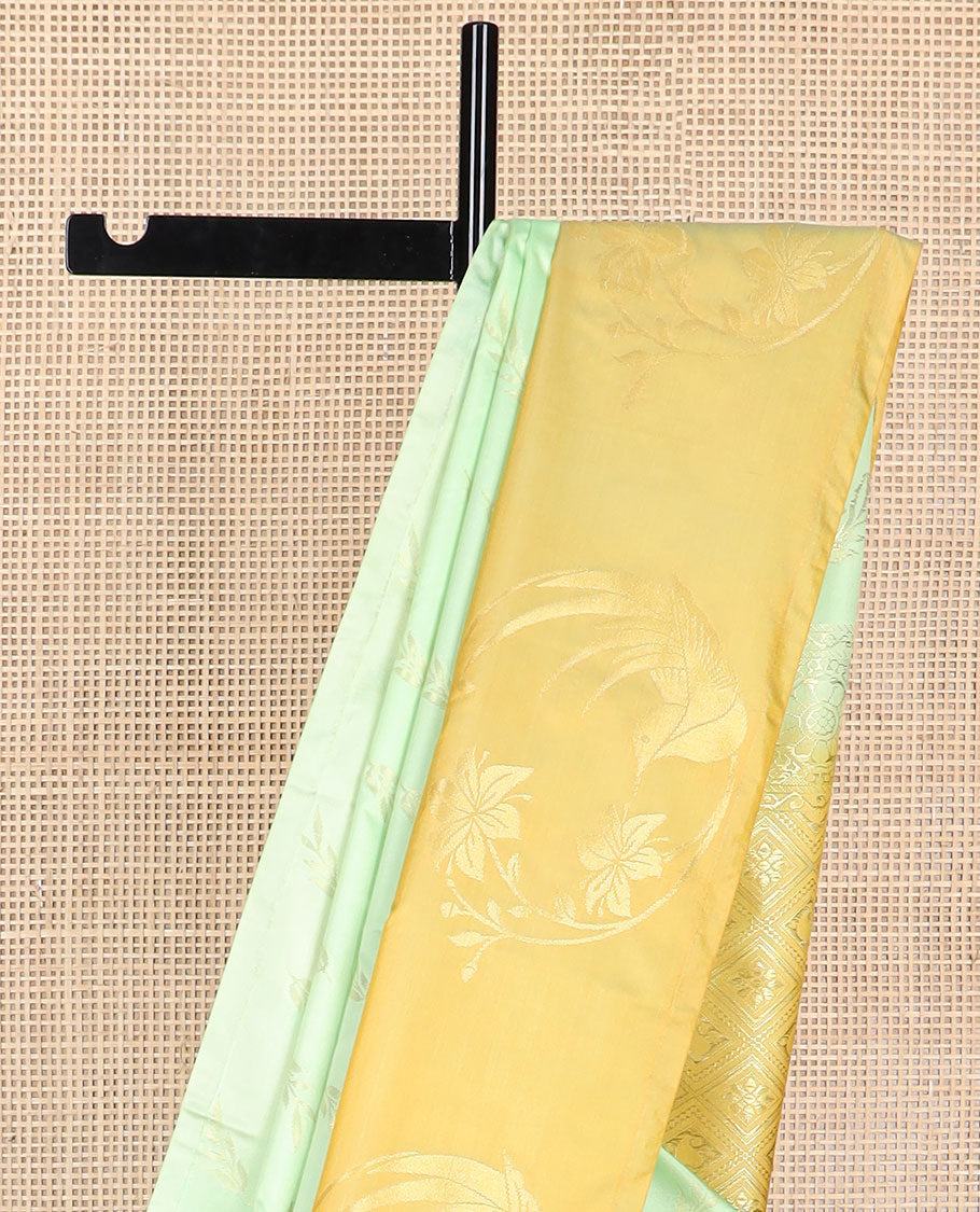 Mint green leaf buttas soft silk saree with contrast floral design border & floral jaal design pallu