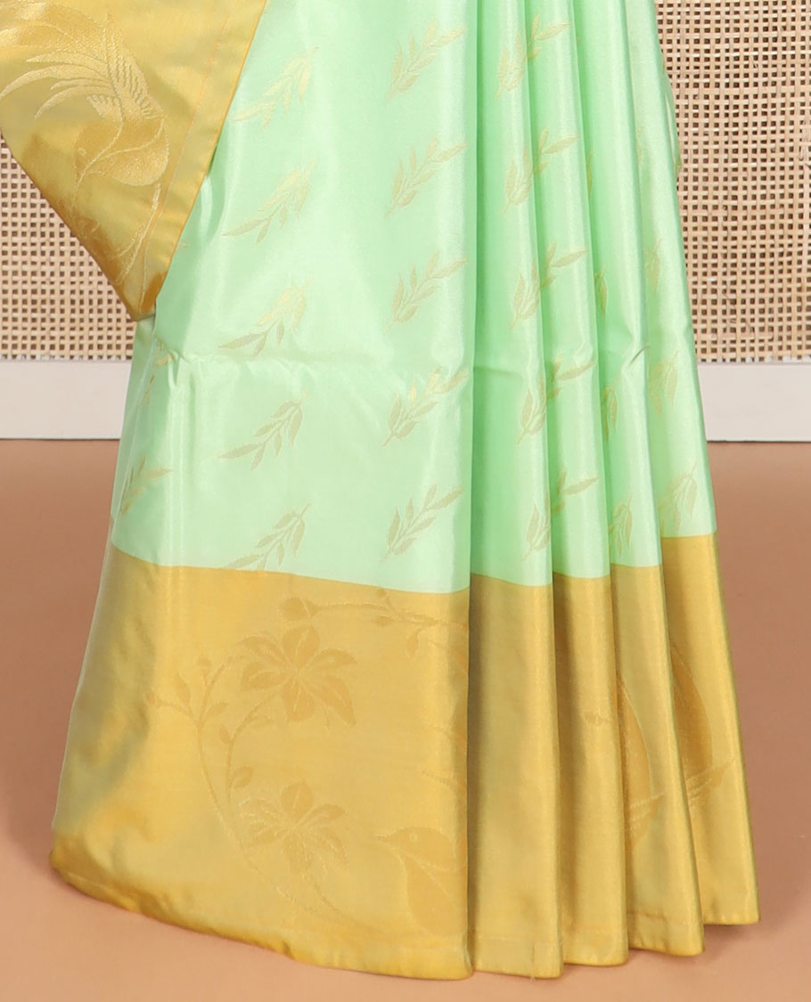 Mint green leaf buttas soft silk saree with contrast floral design border & floral jaal design pallu